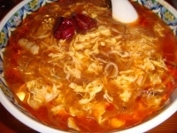 「激辛スーラータンメン[柳麺]」@中国ラーメン 揚州商人 横浜スタジアム前店の写真