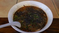「とん骨担々麺　蒸し鶏スモークチャーシュー+黒ゴマ(サービス)」@めんや Bar クアトロの写真