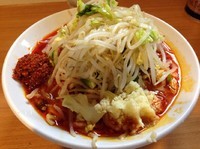 「辛麺小豚入り 麺半分」@豚星。の写真