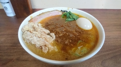 「【今週の限定】濃厚豚骨の大人のカレー麺＋ガッツリ」@丹行味素 北新横浜本店の写真