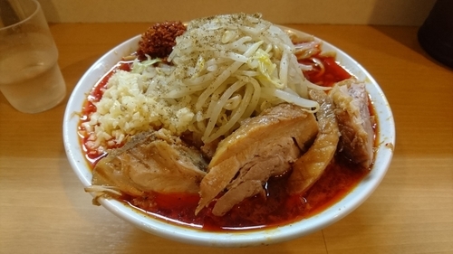 「辛麺(ニンニク・ホアジャオ)+コレ･豚増し」@豚星。の写真