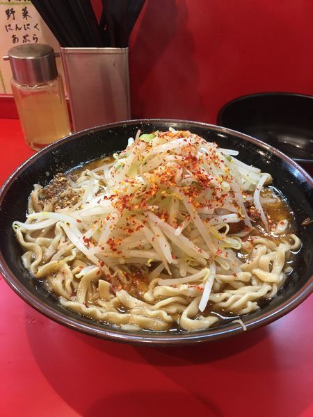 「辛いラーメン小  生卵  とうがらし  しびれ」@麺屋 桐龍の写真