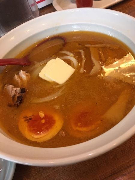 「味玉みそらーめん＋バター 麺半分 ネギもやし抜き」@さっぽろ羅偉伝 高田馬場店の写真