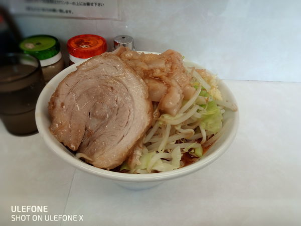 「ミニラーメン 辛いトッピング」@魔人豚の写真