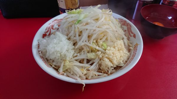 「辛ラーメン ニンニク 生卵 玉ねぎ」@らーめん 武丸の写真