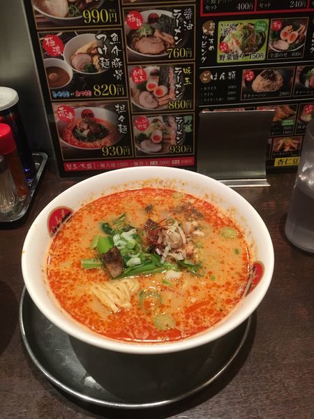 「担々麺(汁あり) 温玉つき」@光麺 池袋本店の写真