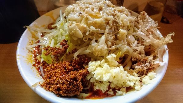 「辛麺(麺少なめ･ヤサイ少なめ･ニンニク･アブラ)+汁無し」@豚星。の写真