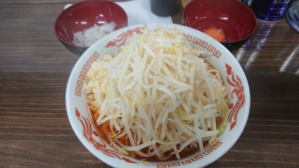 「辛ラーメン ニンニク 生卵 玉ねぎ」@ラーメン武丸の写真