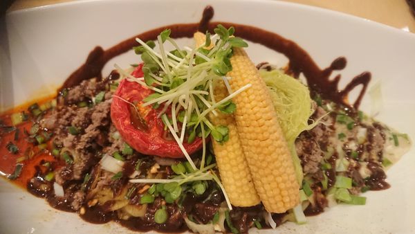 「ヤングコーンとローストトマトの汁なし坦々麺」@饗 くろ㐂の写真