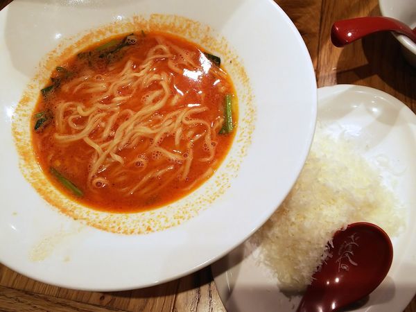 「チーズ降り積もるとまとらーめん　1100円（外税）」@ISOGAMI餃子バル TOMAKOの写真