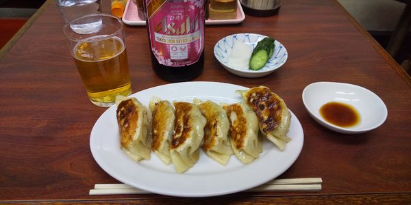 「アサヒスーパードライ・中瓶→餃子(¥550+500)」@ことぶき食堂の写真