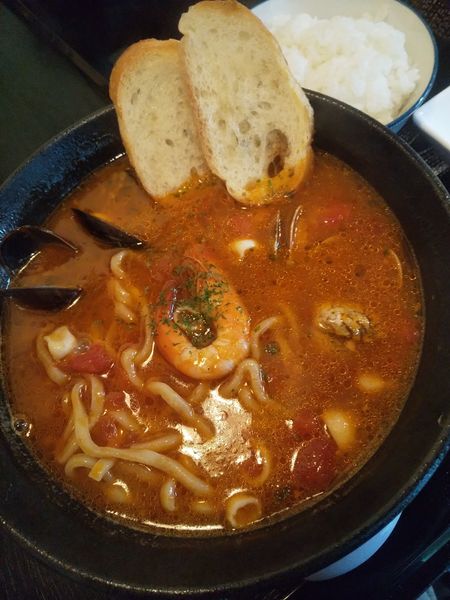 「【限定】魚介たっぷり漁師風トマトヌードル1050円半ライス」@まるふじ食堂の写真