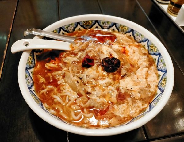 「激辛酸辣湯麺960円」@中国ラーメン 揚州商人 第二産業南中野店の写真