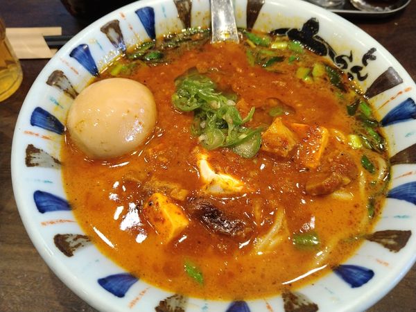 「激辛三昧トッピング味玉」@七志 とんこつ編 大倉山店の写真