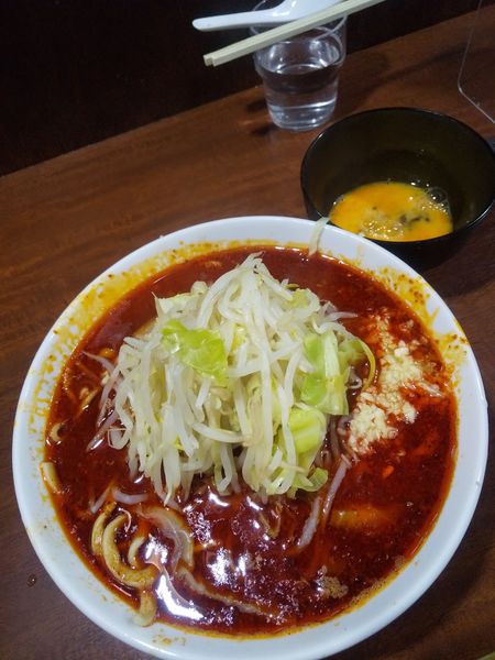 「辛麺920円生玉子50円(麺半分・ニンニク)」@D麺の写真
