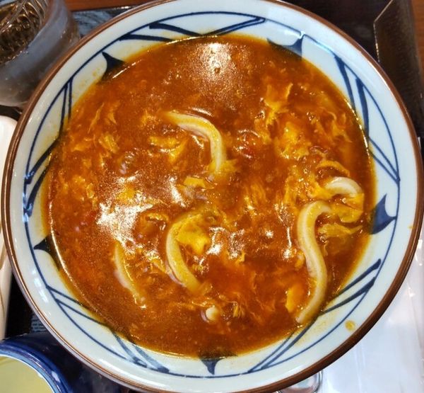 「トマたまカレーうどん690円」@丸亀製麺 山形店の写真