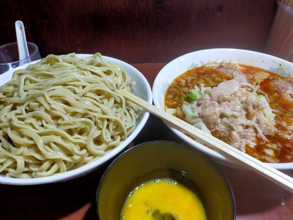 「つけ麺・大600・生卵（脂・にんにく）」@D麺の写真
