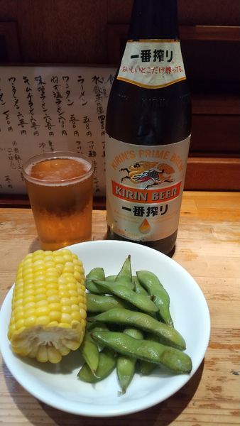 「キリン一番搾り+餃子（¥550+380)」@萬龍軒の写真