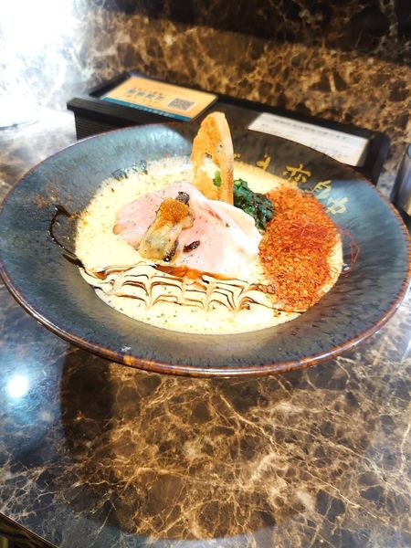 「赤牡蠣ラーメン（3辛）」@ただいま、変身中。の写真