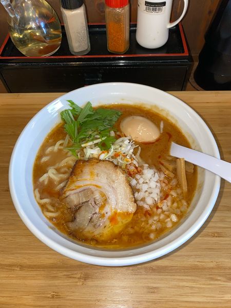 「濃厚鶏白湯の極濃味噌らぁめん煮玉子¥1,250円(限定)」@らぁめん 麺彩家の写真