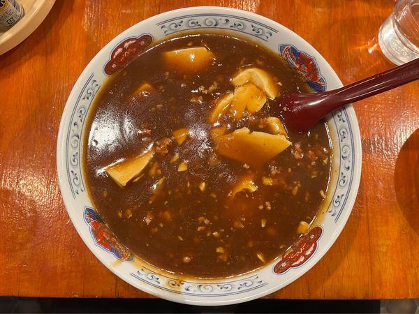 「豆腐メン（辛口）」@興楽の写真