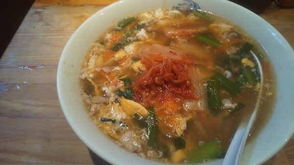 「キリン一番搾り・中瓶→キムチラーメン(¥600+700)」@萬龍軒の写真