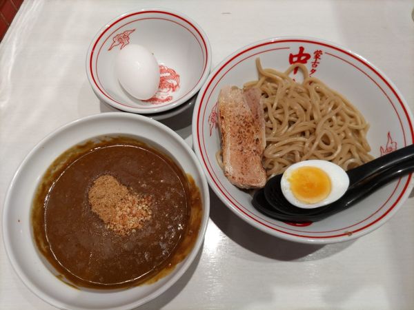 「濃厚カレーつけ麺・熱盛+生卵」@蒙古タンメン 中本 高田馬場店の写真