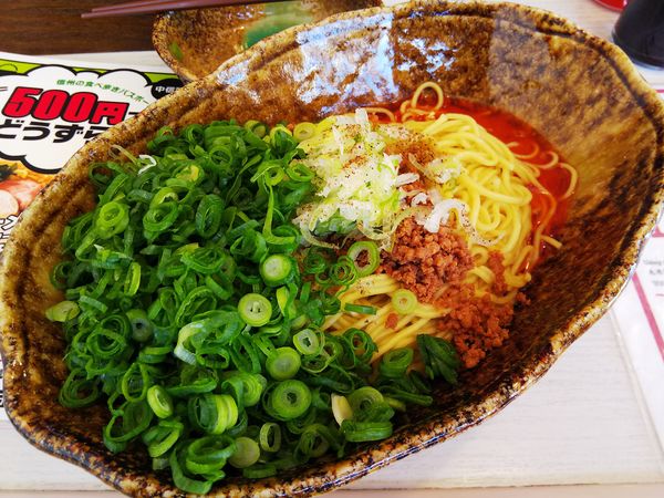 「汁なし担担麺 大盛り ※㋗で500円 +青ネギ増し」@中華そば くにまつ 松本店の写真