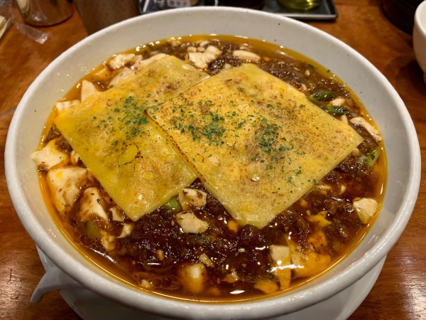 「焼きチーズ麻婆麺1400円」@SHIBIRE-NOODLES 蝋燭屋 京橋エドグラン店の写真