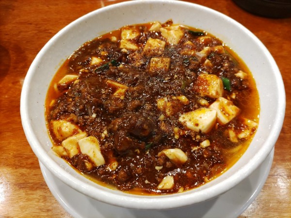 「麻婆麺+サービスライス」@SHIBIRE-NOODLES 蝋燭屋 京橋エドグラン店の写真