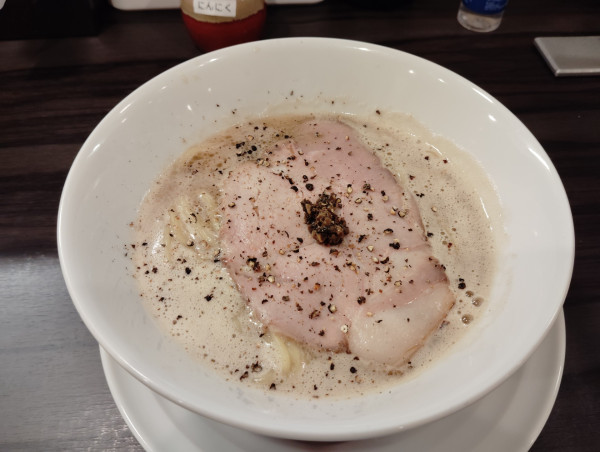 「限定　トリュフ香る牡蠣豚骨らーめん手揉み麺　1000円」@淡麗豚骨 TSUCHINOTOMIの写真