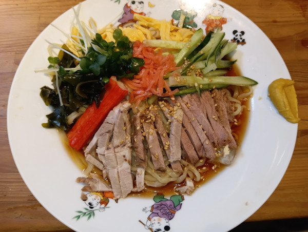 「キリン一番搾り・中瓶→冷し中華(¥600+800)」@萬龍軒の写真