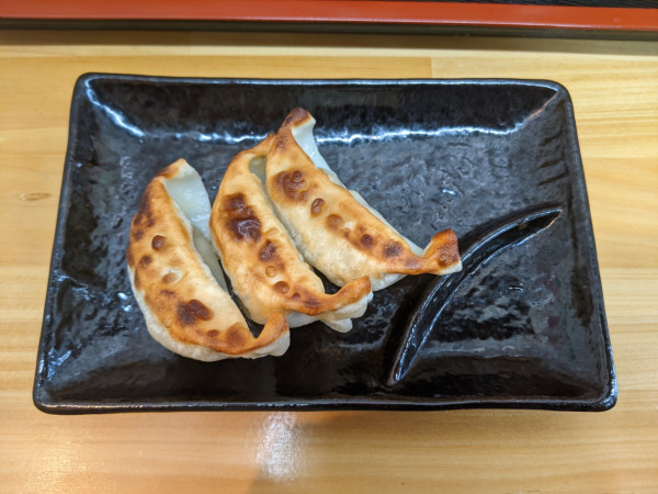 「餃子：180円＋消費税」@まごころ食堂の写真