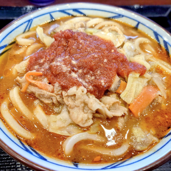 「俺たちのトマト豚汁うどん」@丸亀製麺 品川店の写真