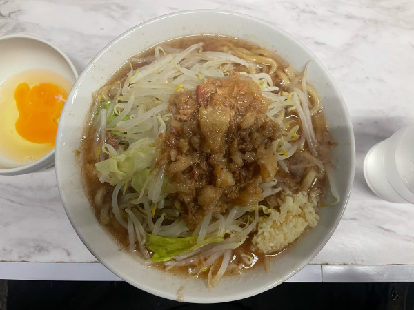 「らーめん ¥980 生卵 ¥90」@らーめん虎丸の写真