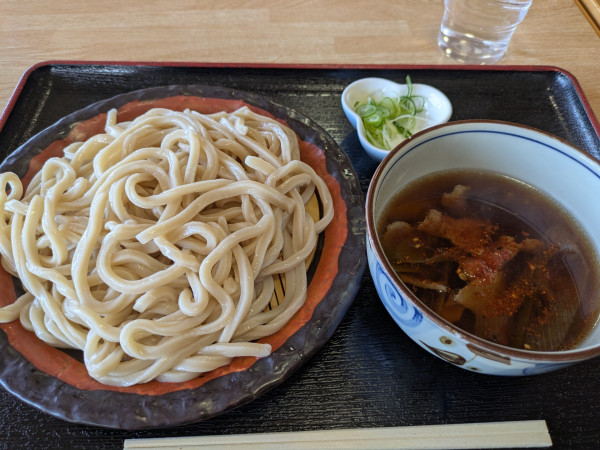 「肉汁うどん(中)750円」@くまどんの写真