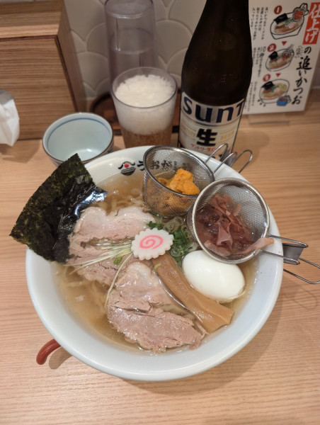 「生うにプレミアム貝だしラーメン+サントリー生中瓶+味玉」@鮨とラーメン うおがしや 渋谷店の写真